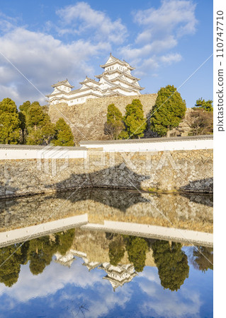 National treasure Himeji Castle at dusk, large castle tower and water mirror, Himeji City, Hyogo Prefecture National treasure Himeji Castle at dusk, large castle tower and water mirror, Himeji City, Hyogo Prefecture 110747710