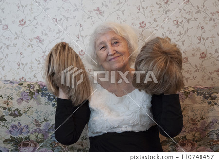 Senior woman with a wig hair, beauty details, hair concept 110748457