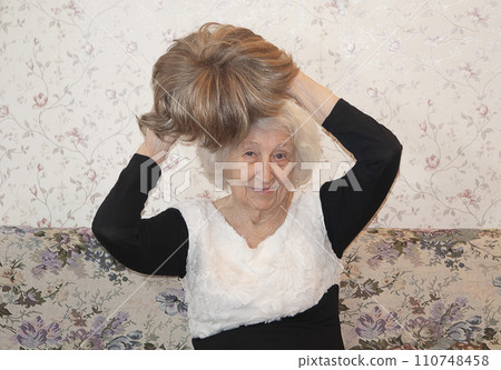 Senior woman with a wig hair, beauty details, hair concept Senior woman with a wig hair, beauty details, hair concept 110748458