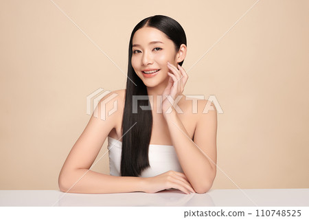 Beautiful young asian woman with clean fresh skin on beige background, Face care, Facial treatment, Cosmetology, beauty and spa, Asian women portrait. 110748525