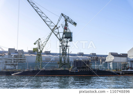 Submarine undergoing maintenance at dock, Kobe City, Hyogo Prefecture Submarine undergoing maintenance at dock, Kobe City, Hyogo Prefecture 110748896