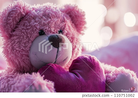 a little bear with pink heart sitting next to it 110751002
