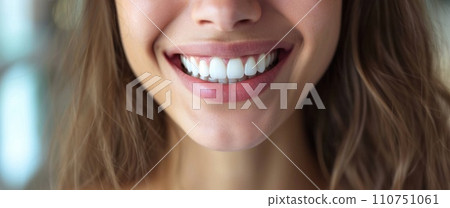 woman smiling with a white smile in the background 110751061
