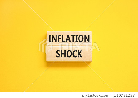 Inflation shock symbol. Concept words Inflation shock on wooden blocks. Beautiful yellow table yellow background. Business inflation shock concept. Copy space. 110751258