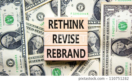 Rethink revise rebrand symbol. Concept word Rethink Revise Rebrand on block. Dollar bills. Beautiful dollar bills background. Business brand motivational rethink revise rebrand concept. Copy space. 110751282