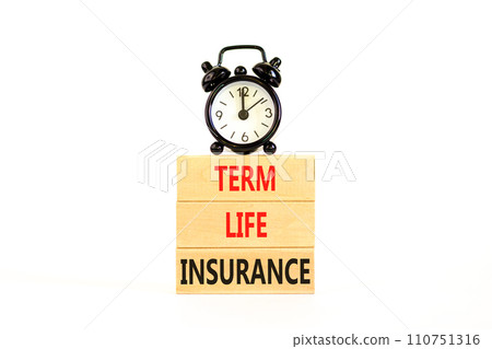 Term life insurance symbol. Concept words Term life insurance on beautiful wooden blocks. Beautiful white table white background. Black alarm clock. Medical term life insurance concept. Copy space. 110751316