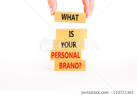 What is your personal brand symbol. Concept words What is your personal brand on wooden blocks. Beautiful white background. Businessman hand. Business, what is your personal brand concept. Copy space. 110751362