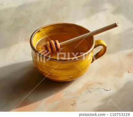 a cup of honey with a wooden stick a cup of honey with a wooden stick 110753229