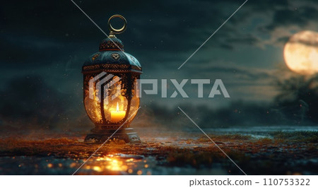 a large black lantern with a crescent and candle 110753322