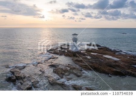 Aerial top view of lighthouse tower, Khao Lak with seawater, Andaman sea in Phang Nga Bay island in summer season, Thailand. Tourist attraction. Aerial top view of lighthouse tower, Khao Lak with seawater, Andaman sea in Phang Nga Bay island in summer season, Thailand. Tourist attraction. 110754039