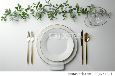 place setting with some green leave branches 110754281