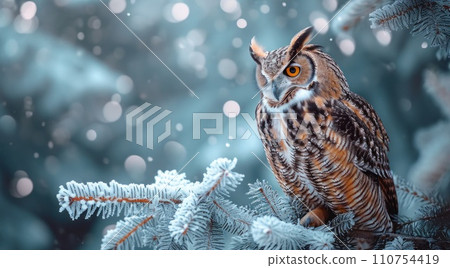the owl is perched on a branch of pine trees 110754419