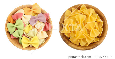 colorful and yellow farfalle pasta in wooden bowl isolated on white background with full depth of field. Top view. Flat lay. 110755428