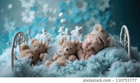 newborn baby boy sleeping in blanket with bears 110755777