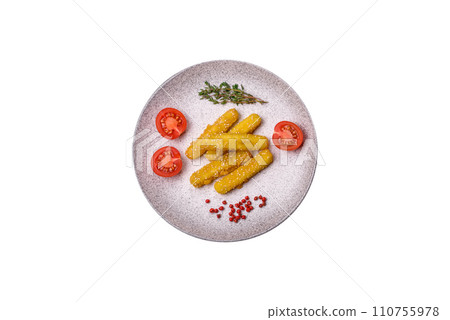 Delicious crispy cheese sticks with mozzarella, salt and spices, breaded and fried in oil 110755978