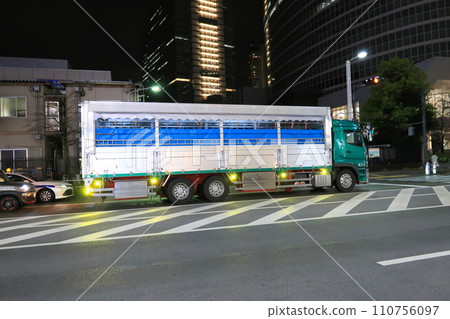 A livestock transport vehicle waiting near a meat processing center 110756097