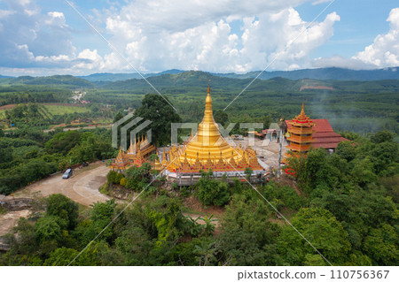 Wat Bang Thong, Krabi, Southern Temple. The pagoda is a buddhist temple in urban city town, Thailand. Thai architecture landscape background. Tourist attraction landmark. 110756367