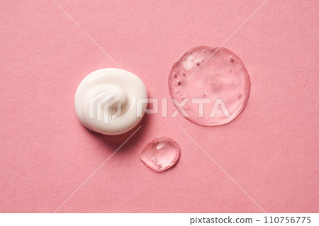 Gel, serum and a cream on a pink background. 110756775