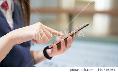 High school girls and junior high school girls operating smartphones High school girls and junior high school girls operating smartphones 110756863