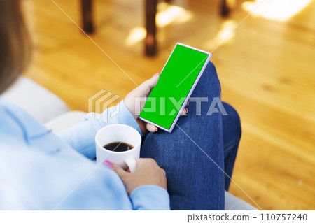 Woman Relaxing with Smartphone and Coffee Woman Relaxing with Smartphone and Coffee 110757240