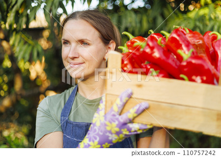 Happy Farmer with Fresh Red Bell Peppers Happy Farmer with Fresh Red Bell Peppers 110757242