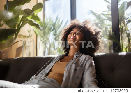 Smiling Afro-American Female Enjoying a Day of Serenity Smiling Afro-American Female Enjoying a Day of Serenity 110758093