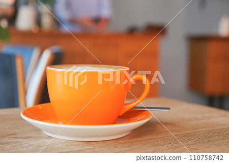 Coffee cup on wood table Coffee cup on wood table 110758742