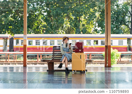 Woman using mobile phone while travel by train. travel concept 110759893
