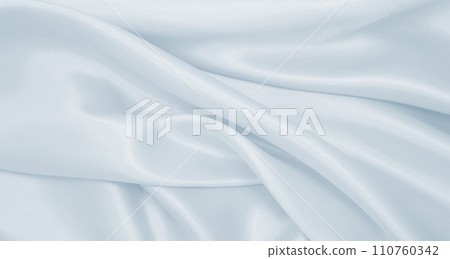 Smooth elegant grey silk or satin luxury cloth as wedding background. Luxurious Christmas background or New Year background design Smooth elegant grey silk or satin luxury cloth as wedding background. Luxurious Christmas background or New Year background design 110760342