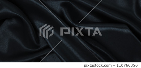 Smooth elegant black silk or satin luxury cloth texture as abstract background. Luxurious background design Smooth elegant black silk or satin luxury cloth texture as abstract background. Luxurious background design 110760350