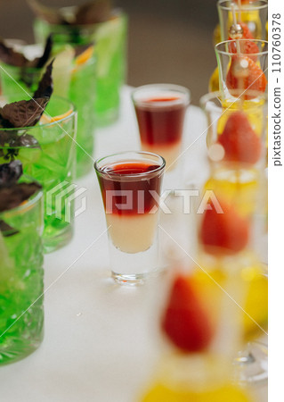 Welcome drink with cocktail glasses and drinks at an event. Alcoholic beverages at a wedding Welcome drink with cocktail glasses and drinks at an event. Alcoholic beverages at a wedding 110760378
