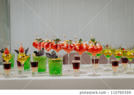 Welcome drink with cocktail glasses and drinks at an event. Alcoholic beverages at a wedding 110760389