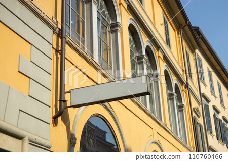 Blank sign mockup in the urban environment. White rectangle sign with blank space for cafe or restaurant name and logo 110760466