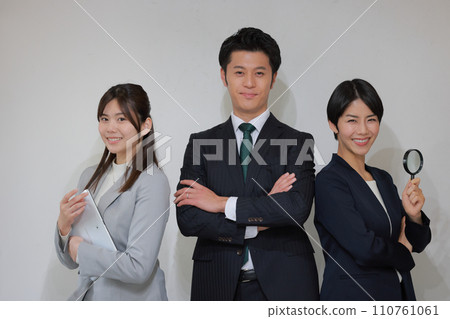 Team of consultants_with tablet and loupe_2 Team of consultants_with tablet and loupe_2 110761061