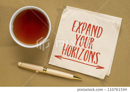 Expand your horizons - inspirational note on a napkin with tea, open mind and personal development concept 110761594