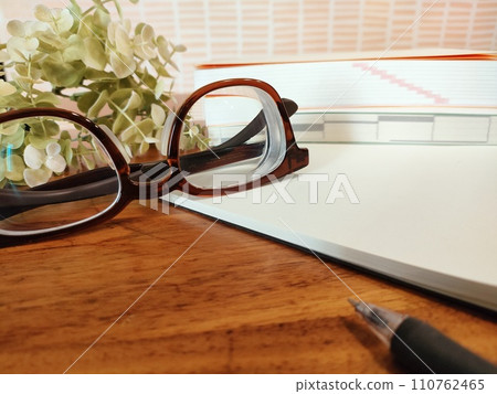 text and notebook on the desk 110762465