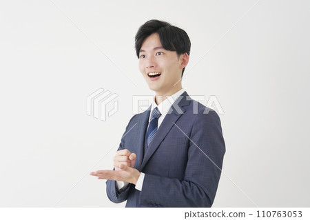 Inspirational young businessman white background Inspirational young businessman white background 110763053