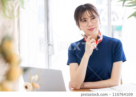 Business woman working on a personal computer Business woman working on a personal computer 110764109