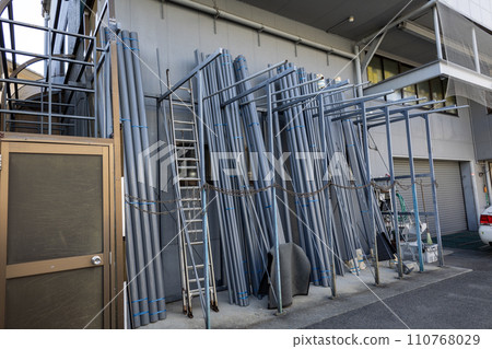 Plastic piping materials propped up 110768029