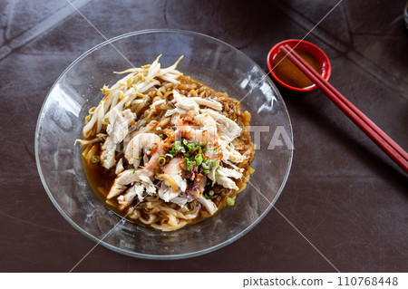 Ipoh popular dry shredded chicken and prawn hor fun noodle served with chili sauce dipping. Ipoh popular dry shredded chicken and prawn hor fun noodle served with chili sauce dipping. 110768448