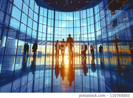 Silhouetted Business Professionals in Modern Office Lobby 110768803