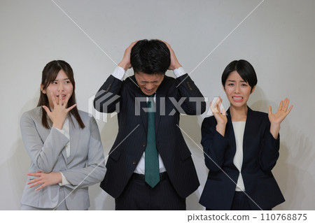 3 business people worried or surprised at the occurrence of trouble_1 110768875