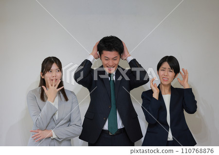 3 business people worried or surprised by the occurrence of trouble_2 3 business people worried or surprised by the occurrence of trouble_2 110768876