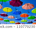 colorful umbrella and blue sky 110770230