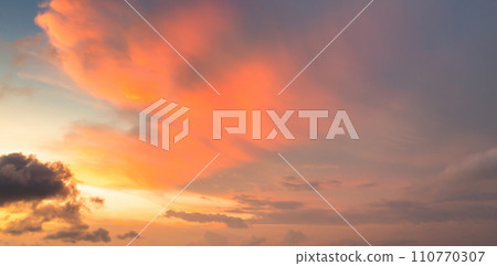 Sunset sky. Abstract nature background. Dramatic blue with orange colorful clouds in twilight time. Sunset sky. Abstract nature background. Dramatic blue with orange colorful clouds in twilight time. 110770307