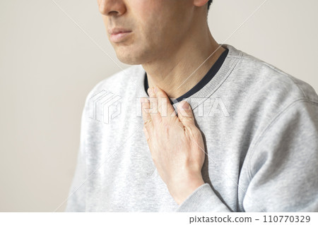 A man concerned about his throat 110770329