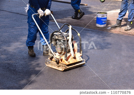 Asphalt pavement work 110770876