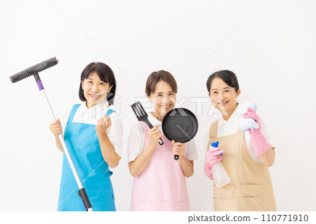 Woman in apron housekeeping 110771910