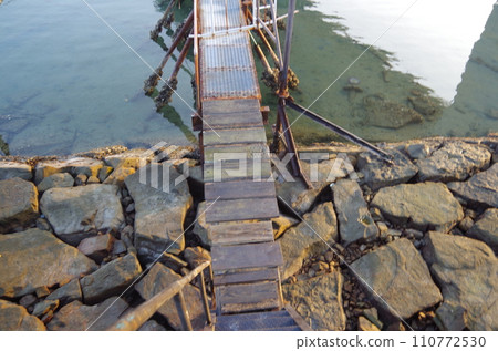 A ferry that juts out into the river mouth A ferry that juts out into the river mouth 110772530