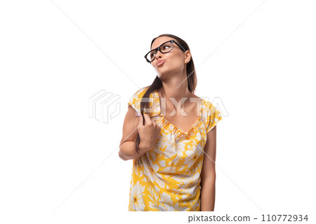 portrait of a slender young woman with glasses for vision correction on a white background 110772934